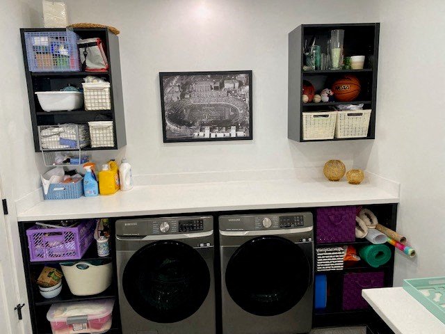 a laundry room with a washer and a dryer